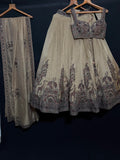 Nyraa Cream Golden Embroidered Lehenga Choli