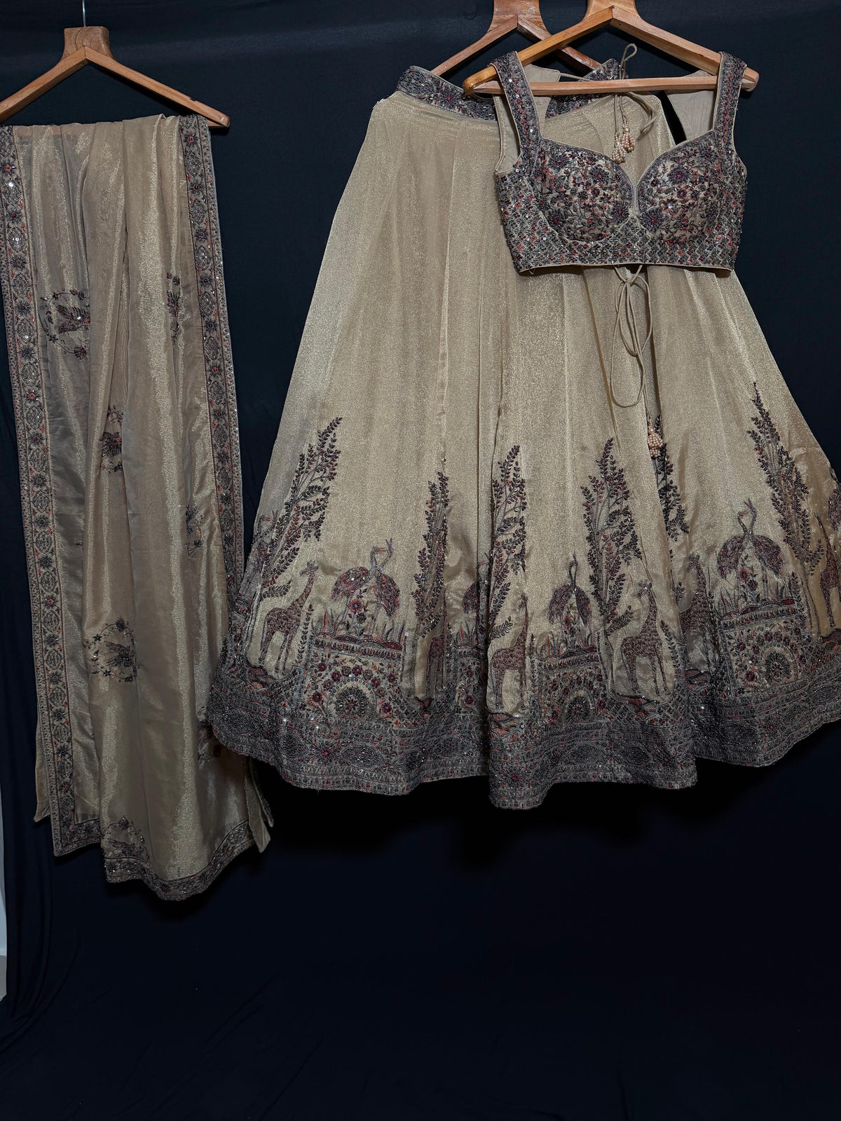 Nyraa Cream Golden Embroidered Lehenga Choli