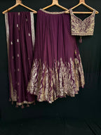 Nyraa Wine Purple Embroidered Lehenga Choli with Gold Zari Work